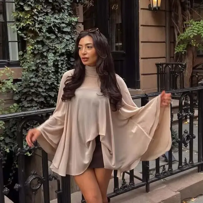 YENKYE nouvelle mode col haut Cape haut pour femmes élégantes ourlet asymétrique chemisier en mousse