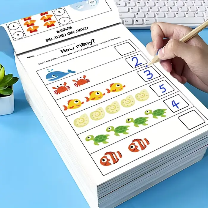 Cahier d'exercices de mathématiques préscolaires, comprenant des pages d'addition et de soustraction